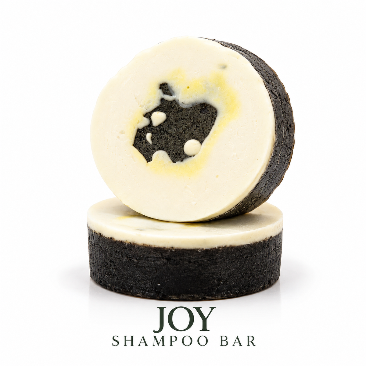Loveyemmaskincare Joy Shampoo Bar placed on a surface, showcasing its rectangular shape and natural packaging.