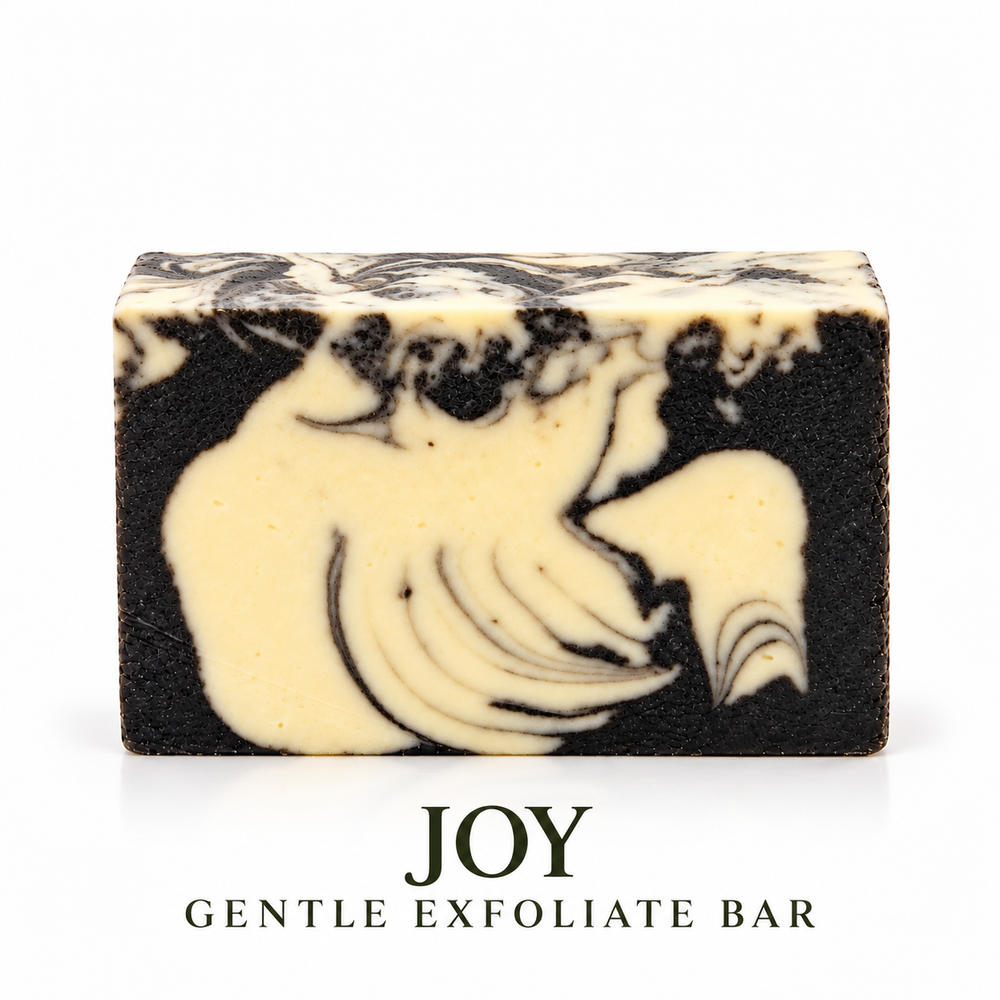 Joy Gentle Exfoliate soap bar by LOVEBYEMMASKINCARE with textured surface for gentle skin exfoliation.