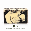 Joy Gentle Exfoliate soap bar by LOVEBYEMMASKINCARE with textured surface for gentle skin exfoliation.