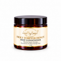 LOVEBYEMMASKINCARE Holy Forever Honey Deep Conditioner jar showing the product label and creamy texture.
