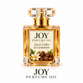 Joy perfume oil by LOVEBYEMMASKINCARE featuring a sweet coffee and cardamom scent in a sleek, elegant bottle.