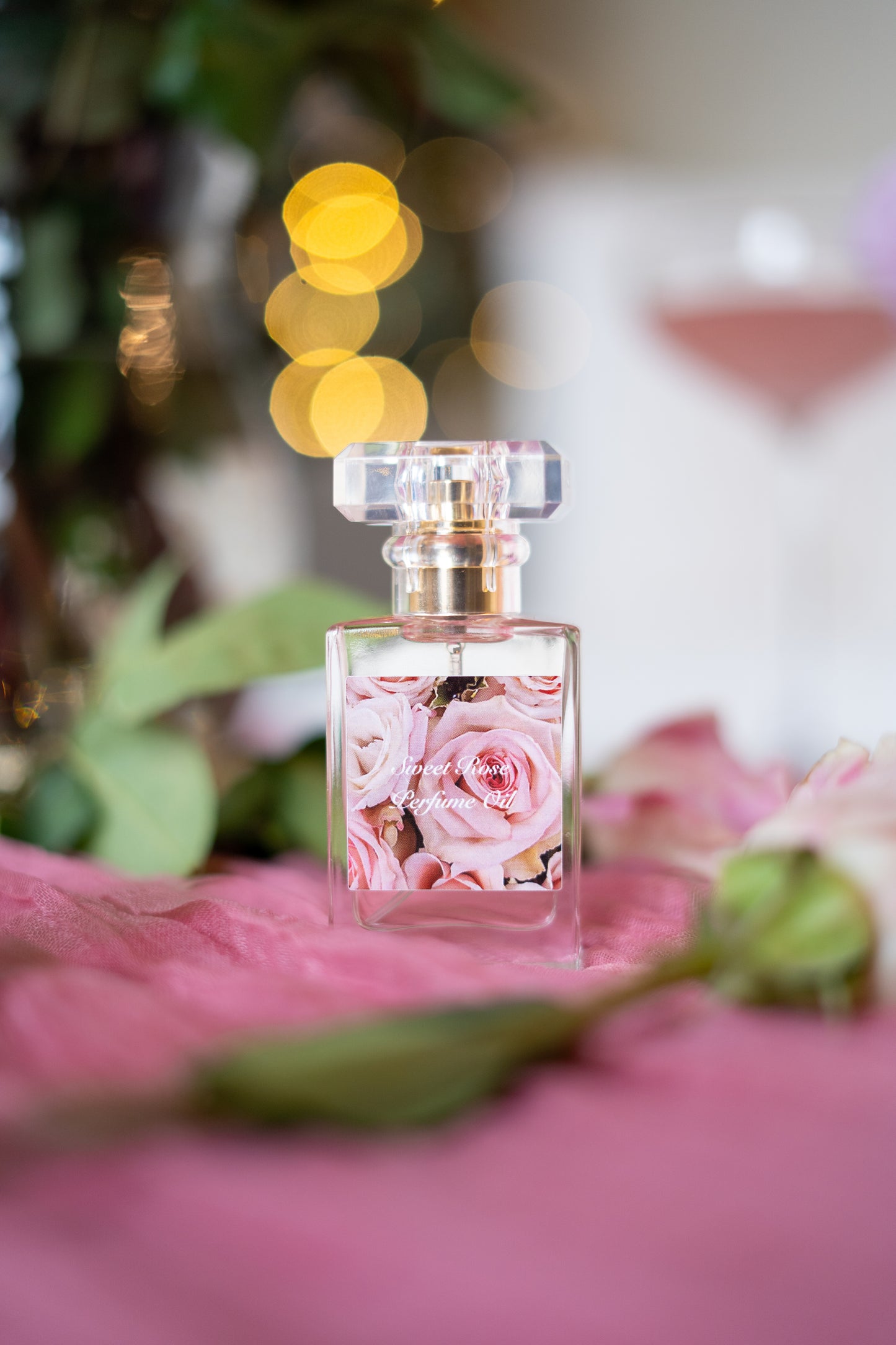 Beauty For Ashes Perfume Oil by LOVEBYEMMASKINCARE with fresh cut rose scent, elegant glass bottle and floral design.