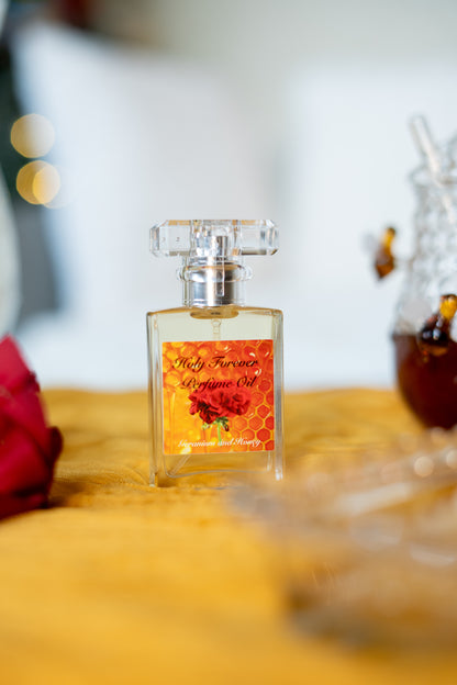 Holy Forever perfume oil by LOVEBYEMMASKINCARE featuring sweet honey and geranium notes in a sleek glass bottle.