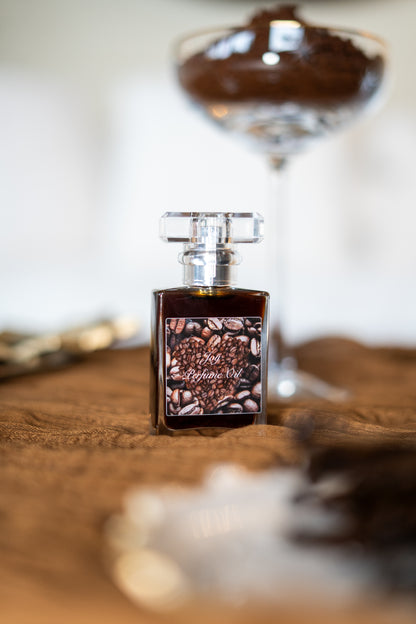 Joy Perfume Oil by LOVEBYEMMASKINCARE featuring sweet coffee and cardamom notes in a sleek glass bottle.